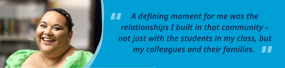 Aveta standing and smiling in a classroom, accompanied by the quote, “A defining moment for me was the relationships I built in that community – not just with the students in my class, but my colleagues and their families.”